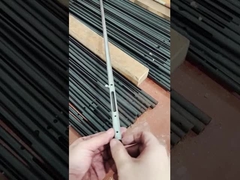 A man is showcasing a small component made of carbon steel pipe